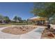 Community park area with playground, shade structures, and lush greenery at 5896 Shining Moon Ct, Las Vegas, NV 89131