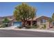 Charming single-story home with a well-manicured front yard and a delightful desert landscape at 5896 Shining Moon Ct, Las Vegas, NV 89131