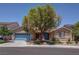 Charming single-story home with a well-manicured front yard and a delightful desert landscape at 5896 Shining Moon Ct, Las Vegas, NV 89131
