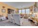 Cozy living room features neutral walls, carpet flooring, and comfortable seating arrangements at 5896 Shining Moon Ct, Las Vegas, NV 89131