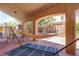 Covered patio with hammock and seating offers a relaxed outdoor living space at 5896 Shining Moon Ct, Las Vegas, NV 89131
