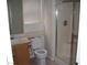 Clean bathroom featuring a shower, white toilet, and vanity with a sink at 59 Belle Maison Ave, Las Vegas, NV 89123