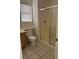 Bathroom features a tile floor and a glass-enclosed shower at 59 Belle Maison Ave, Las Vegas, NV 89123
