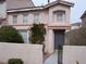 Charming two-story townhome featuring a front door and manicured landscaping at 59 Belle Maison Ave, Las Vegas, NV 89123