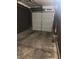The garage features a concrete floor and a white sectional garage door at 59 Belle Maison Ave, Las Vegas, NV 89123