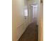 Carpeted hallway with neutral walls, a closet, and access to other rooms at 59 Belle Maison Ave, Las Vegas, NV 89123