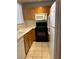 Kitchen features wood cabinets, laminate counters and a black range at 59 Belle Maison Ave, Las Vegas, NV 89123