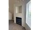 Living room featuring a fireplace with black trim and built-in niche at 59 Belle Maison Ave, Las Vegas, NV 89123