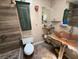 Unique bathroom featuring a wood vanity, a tiled shower, and rustic decor at 632 Tam O Shanter, Las Vegas, NV 89109