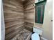 Updated bathroom with a tiled shower, modern fixtures, and a rustic-style cabinet at 632 Tam O Shanter, Las Vegas, NV 89109