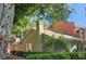 Charming home with mature trees, a chimney, and a well-manicured lawn at 632 Tam O Shanter, Las Vegas, NV 89109