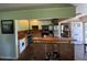 Functional kitchen with vintage cabinets, stainless steel appliances, and a central island with bar seating at 632 Tam O Shanter, Las Vegas, NV 89109