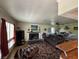Cozy living room with a fireplace, plush seating, and plenty of natural light at 632 Tam O Shanter, Las Vegas, NV 89109