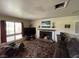 Inviting living room showcasing a fireplace, large windows, and a comfortable seating area at 632 Tam O Shanter, Las Vegas, NV 89109