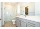 Bathroom featuring a glass-enclosed shower, modern vanity, and stylish fixtures at 7199 Twilight Rider Ct, Las Vegas, NV 89118