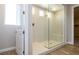 Bathroom featuring a glass enclosed shower with tile surround and built in bench at 7199 Twilight Rider Ct, Las Vegas, NV 89118