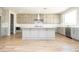 Modern kitchen featuring a large island, stainless steel appliances, and stylish cabinetry at 7199 Twilight Rider Ct, Las Vegas, NV 89118