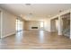 Spacious living room with tile floors, fireplace, sliding glass doors, and recessed lighting at 7199 Twilight Rider Ct, Las Vegas, NV 89118