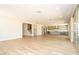Spacious living room showcasing tile flooring and easy access to both the kitchen and stairs at 7199 Twilight Rider Ct, Las Vegas, NV 89118