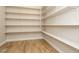 Walk-in pantry featuring built-in shelving for organized storage of food and kitchen essentials at 7199 Twilight Rider Ct, Las Vegas, NV 89118