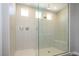 Glass enclosed shower with tile surround, built-in bench, and multiple shower heads at 7199 Twilight Rider Ct, Las Vegas, NV 89118