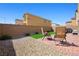 Picturesque backyard with a mix of gravel, brick, and artificial grass, ideal for outdoor enjoyment at 7730 Moore Creek Ln, North Las Vegas, NV 89084