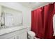 Bathroom featuring a vanity with granite countertop and a bright red shower curtain at 7730 Moore Creek Ln, North Las Vegas, NV 89084