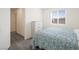 Well-lit bedroom with a three-drawer dresser and a comfortable bed at 7730 Moore Creek Ln, North Las Vegas, NV 89084