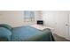 A bright bedroom featuring a large window, closet and neutral decor at 7730 Moore Creek Ln, North Las Vegas, NV 89084