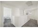 Bright hallway area with gray carpet at 7730 Moore Creek Ln, North Las Vegas, NV 89084