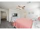 Serene primary bedroom with a ceiling fan, closet, and carpeted floor, creating a cozy and private retreat at 7730 Moore Creek Ln, North Las Vegas, NV 89084