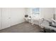 Bright office space with multiple work areas and natural light at 7730 Moore Creek Ln, North Las Vegas, NV 89084