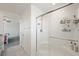 Bright shower with glass door and subway tile at 7730 Moore Creek Ln, North Las Vegas, NV 89084