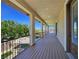 Spacious balcony with wrought iron railing overlooking the pool, spa, and lush landscaping at 8010 Palm Cove Ct, Las Vegas, NV 89129