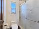 Bathroom featuring a stylish glass-enclosed shower with decorative tile and updated fixtures at 8010 Palm Cove Ct, Las Vegas, NV 89129
