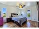 Bright bedroom with a ceiling fan and access to a balcony at 8010 Palm Cove Ct, Las Vegas, NV 89129
