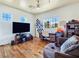 Bright bedroom with hardwood floors, large windows and a ceiling fan at 8010 Palm Cove Ct, Las Vegas, NV 89129