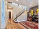 Elegant entryway with staircase, wood floors, and stylish accents at 8010 Palm Cove Ct, Las Vegas, NV 89129