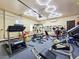 Well-equipped home gym with modern exercise equipment and unique lighting at 8010 Palm Cove Ct, Las Vegas, NV 89129
