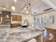 Modern kitchen with a large island, granite countertops, and modern fixtures at 8010 Palm Cove Ct, Las Vegas, NV 89129