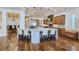 Open-concept kitchen with an island, a breakfast bar, pendant lighting, and stainless steel appliances at 8010 Palm Cove Ct, Las Vegas, NV 89129