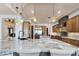 Spacious kitchen with granite countertops, stainless steel appliances, and pendant lighting at 8010 Palm Cove Ct, Las Vegas, NV 89129