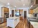A chef's kitchen with stainless steel appliances, custom cabinetry, marble countertops and a large island at 8010 Palm Cove Ct, Las Vegas, NV 89129