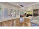 Bright living room with French doors, recessed lighting, fireplace, and hardwood floors at 8010 Palm Cove Ct, Las Vegas, NV 89129