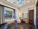 Elegant main bathroom featuring a clawfoot tub, vanity area, stone floors, and ample natural light at 8010 Palm Cove Ct, Las Vegas, NV 89129