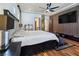 Luxurious main bedroom features a ceiling fan, hardwood floors, ample closet space and modern finishes at 8010 Palm Cove Ct, Las Vegas, NV 89129