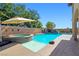 Beautiful backyard pool and spa area, creating a serene outdoor oasis for enjoyment at 8010 Palm Cove Ct, Las Vegas, NV 89129