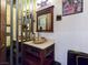 Charming powder room with a vessel sink, decorative mirror and ornate vanity at 8010 Palm Cove Ct, Las Vegas, NV 89129