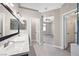Bathroom with double sinks, open doorway to main bedroom, and tile flooring at 814 Singing Drum Dr, Henderson, NV 89002