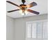 Bedroom with ceiling fan and window with shutters at 814 Singing Drum Dr, Henderson, NV 89002